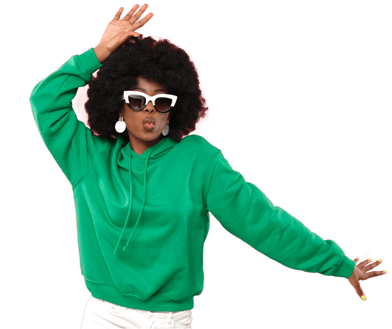 lady wearing green jumper and sunglasses posing