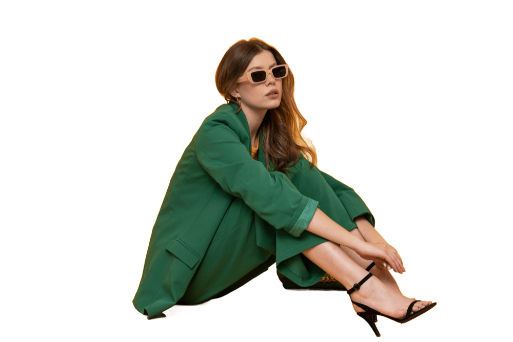 hot woman in green wearing sun glasses